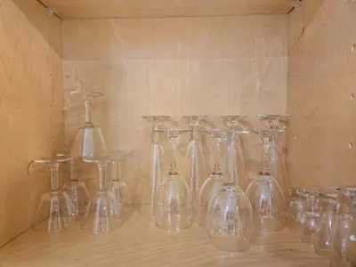a group of glass wine glasses sitting on a shelf at 8356 Adam back unit 2bed 2bath by sdstay in Lemon Grove