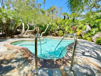 a swimming pool with a metal rail around it at C302 - Surfside Sactuary in Oceanside