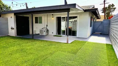 a house with a screened in porch with a yard at Gillespie 2bed 1 bath 1063 by SD Stay in Spring Valley