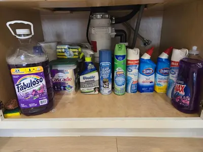 a shelf with a bunch of different cleaning products at Gillespie 2bed 1 bath 1063 by SD Stay in Spring Valley