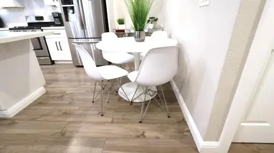 a kitchen with a white table and white chairs at Gillespie 2bed 1 bath 1063 by SD Stay in Spring Valley