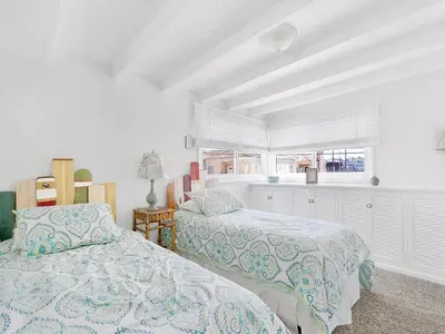 a bedroom with two beds and a window at 1101 W Bay Ave in Newport Beach