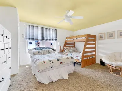 a bedroom with two beds and a ceiling fan at 1101 W Bay Ave in Newport Beach