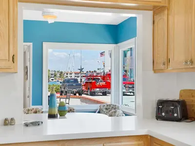 a kitchen with a window with a view of a parking lot at 1101 W Bay Ave in Newport Beach