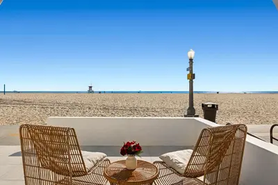 two chairs and a table at the beach at 1628 West Oceanfront Oasis - All Units in Newport Beach