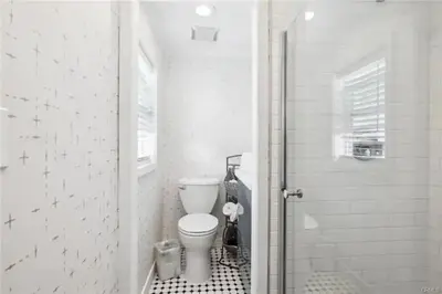 a bathroom with a toilet and a walk in shower at 1628 West Oceanfront Oasis - 5,8,9 in Newport Beach