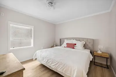 a white bedroom with a bed and a window at 1628 West Oceanfront Oasis - 4,6,7 in Newport Beach
