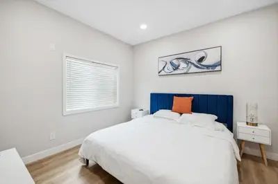 a bedroom with a large white bed and a window at 1628 West Oceanfront Oasis - 4,6,7 in Newport Beach