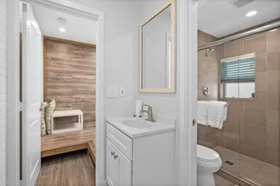 a white bathroom with a sink and a toilet at 1628 West Oceanfront Oasis - 4,6,7 in Newport Beach