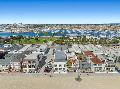 an aerial view of a beach with houses and a harbor at 1628 West Oceanfront Oasis 7 in Newport Beach