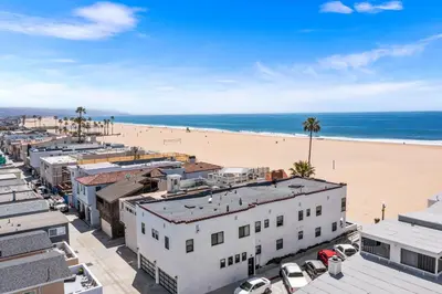 an aerial view of a beach and buildings at 1628 West Oceanfront Oasis 9 in Newport Beach