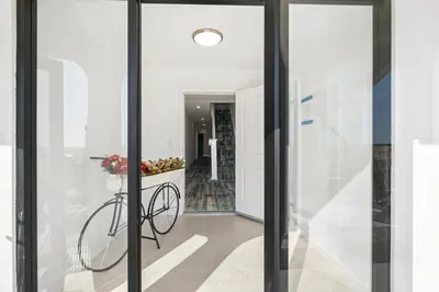 a bicycle is in the hallway of a house at 1628 West Oceanfront Oasis 9 in Newport Beach