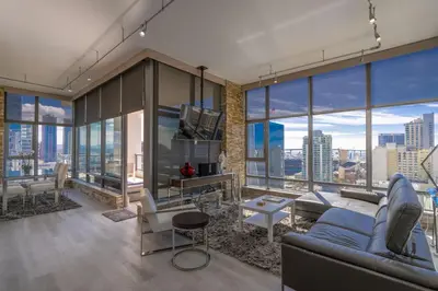 a living room with a view of a city at Cityscape Elegance with Water Views in San Diego