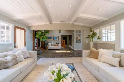 a living room with white furniture and a coffered ceiling at Dolphin's Paradise in San Diego