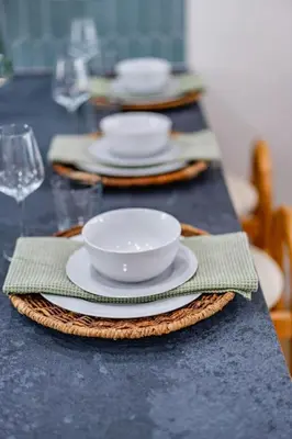 a table with plates and bowls on top of it at Newly Remodeled Uptown Chic in San Diego