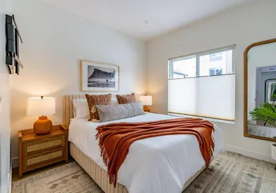 a bedroom with a large bed and a window at Newly Remodeled Uptown Chic in San Diego
