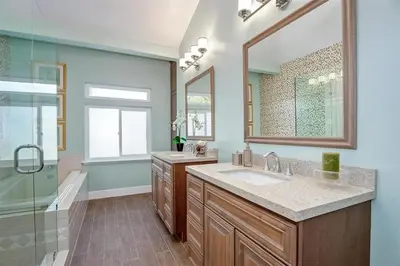 a bathroom with a sink and a shower and a mirror at Upscale Beach Cottage a Block to the Beach Sauna in Encinitas