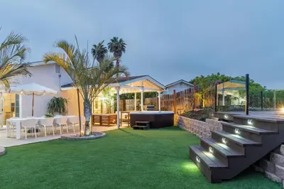 a backyard with benches and a table and chairs at Luxury Home with Views 15 Min to DT & Coronado Beach in San Diego