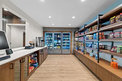 a grocery store aisle with shelves of food at Everhome Suites Temecula in Temecula