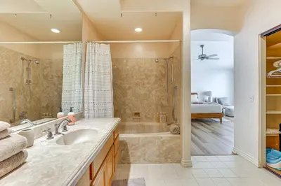 a bathroom with a sink and a shower and a tub at Escondido Townhome with Gas Grill and Golf Acess! in Escondido