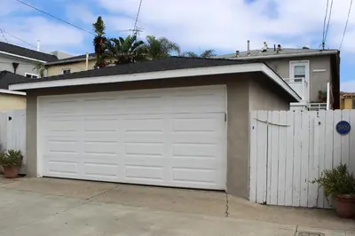 a white garage door in front of a house at 1009 W Bay in Newport Beach