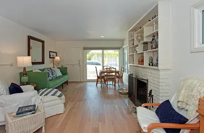 a living room with a couch and a fireplace at 1009 W Bay in Newport Beach