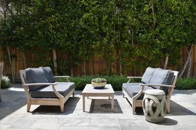 two chairs and a coffee table on a patio at 1028 W Oceanfront in Newport Beach