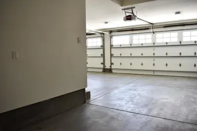 an empty garage with white walls and white garage stalls at 1028 W Oceanfront in Newport Beach