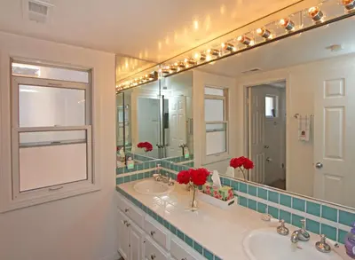 a bathroom with two sinks and a large mirror at 1023 E Balboa B in Newport Beach