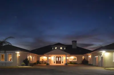 a large house at night with its lights on at Luxurious Mansion in Wine Country in Temecula