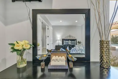 a mirror sitting on a table in a living room at Luxurious Mansion in Wine Country in Temecula