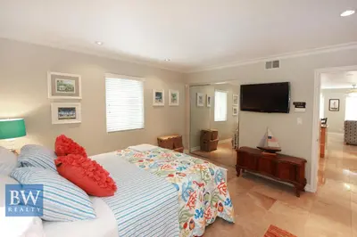 a bedroom with a bed and a flat screen tv at 3 Bedrooms in Newport Beach