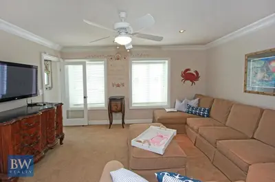 a living room with a couch and a flat screen tv at 3 Bedrooms in Newport Beach