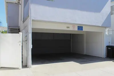 a garage with a door open in a building at 4 Bedrooms in Newport Beach