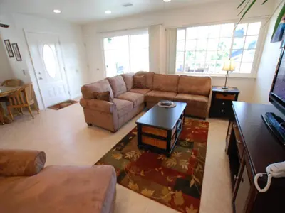 a living room with a couch and a table at 4 Bedrooms in Newport Beach