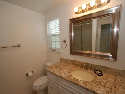 a bathroom with a sink and a toilet and a mirror at 4 Bedrooms in Newport Beach