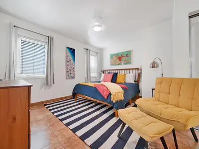 a bedroom with a bed and a couch at 3 Bedrooms in Newport Beach