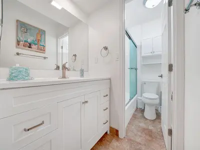 a white bathroom with a sink and a toilet at 3 Bedrooms in Newport Beach