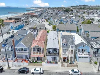an aerial view of a town with houses and the ocean at 3 Bedrooms in Newport Beach