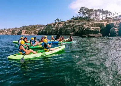 a group of people in kayaks in the water at Stylish 1Br Retreat With Garage AC Close 2 Everything in San Diego