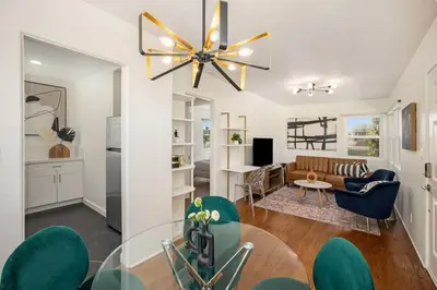 a living room with a ceiling fan and a dining room at Stylish 1Br Retreat With Garage AC Close 2 Everything in San Diego