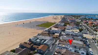 an aerial view of a beach next to the ocean at 1225 W Balboa Blvd A in Newport Beach