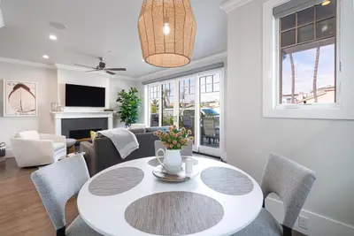 a living room with a table and chairs at 1225 W Balboa Blvd A in Newport Beach