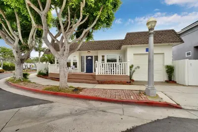 a house with a street light in front of it at 129 G St in Newport Beach