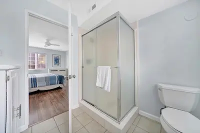 a bathroom with a shower and a toilet at 1404 W Oceanfront A in Newport Beach