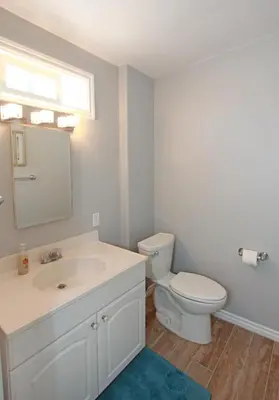a bathroom with a white sink and a toilet at 1759 Miramar Dr in Newport Beach