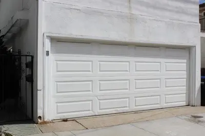 a white garage door on the side of a house at 1807 W Bay Unit B in Newport Beach