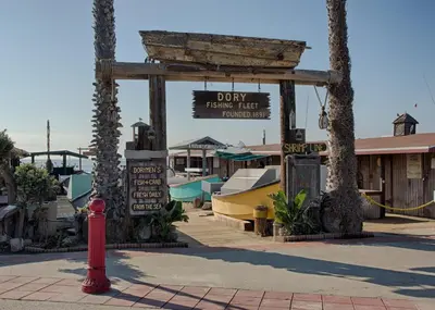 a red fire hydrant in front of a market with a sign at 2010 W Oceanfront in Newport Beach