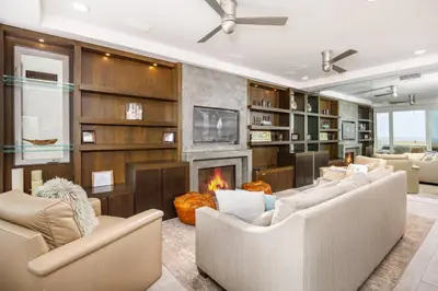 a living room with two couches and a fireplace at 204 E Oceanfront B in Newport Beach