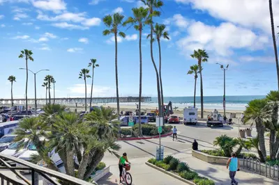 a view of the beach and palm trees at 2314 W Oceanfront A in Newport Beach